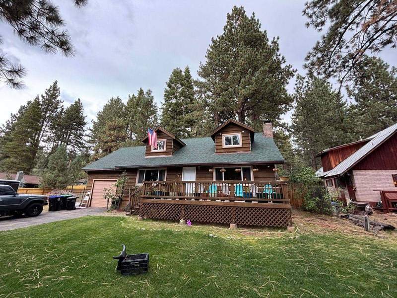 Brown log-sided cabin in the South Lake Tahoe area with a new architectural asphalt shingle roof