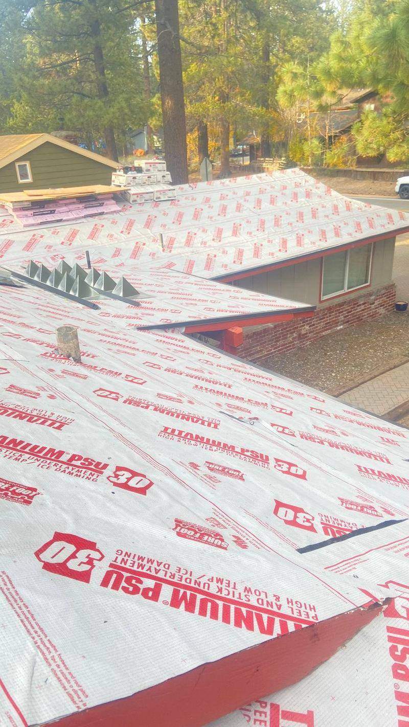 Roof deck covered in red synthetic underlayment and ice-and-water shield during a Trejo Heritage Roofing installation in South Lake Tahoe